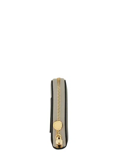 Stella Mccartney Zipped Wallet With Circular Logo And Gold Hardware In Black