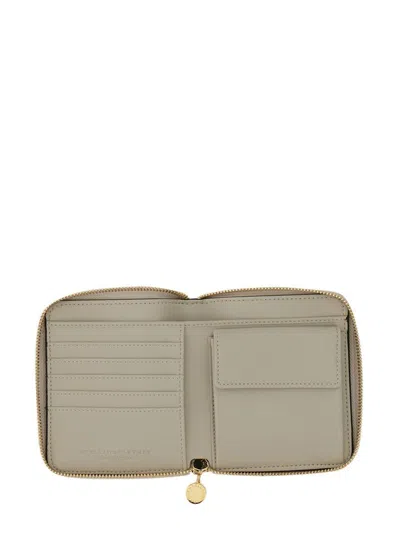Stella Mccartney Zipped Wallet With Circular Logo And Gold Hardware In Black