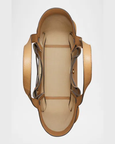 Tory Burch Jacquemus Ovalo Clutch In Tiramisu