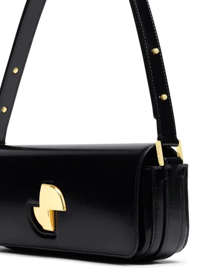 Patou Shoulder Bag With Structured Silhouette And Adjustable Strap In Black