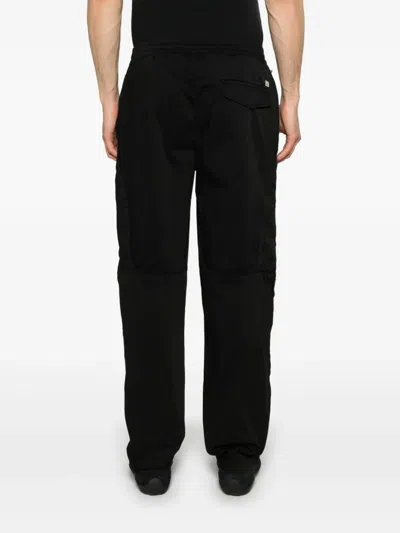 C.p. Company Contemporary Black Trousers With Elasticated Waistband And Zip Pockets In Black