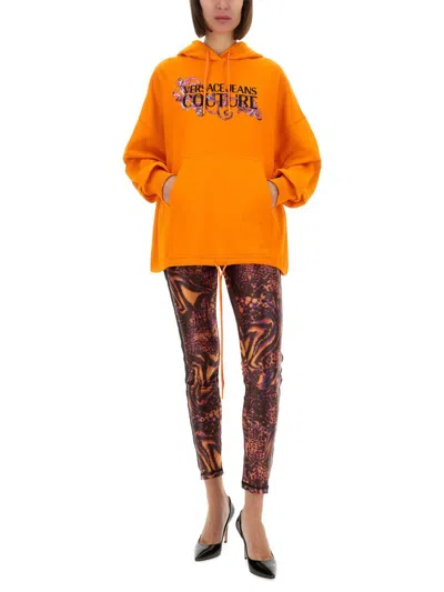 Versace Jeans Couture Hoodie With Logo And Crystals In Orange