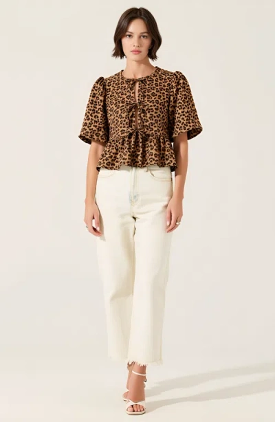 Modenaire Peplum Top With Front Tie Closures And Short Puff Sleeves In Leopard Print