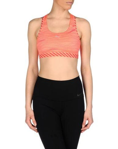 Shop Puma Sports Bras And Performance Tops In Coral