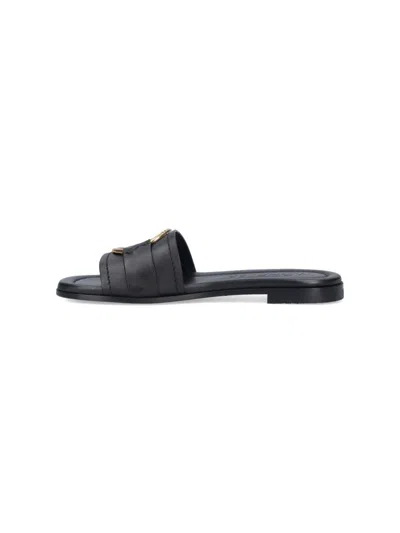 Moncler Black Slides With Distinctive Gold Emblem In Black