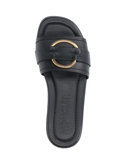 Moncler Black Slides With Distinctive Gold Emblem In Black