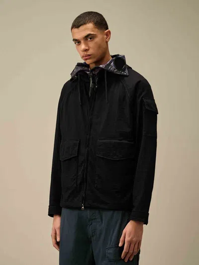 C.p. Company Blue Jacket With Explorer Hood And Adjustable Drawstring Waist In Tech Fabric Man In Black