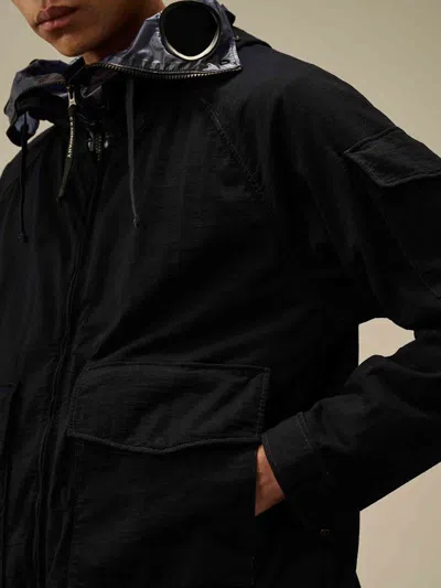 C.p. Company Blue Jacket With Explorer Hood And Adjustable Drawstring Waist In Tech Fabric Man In Black