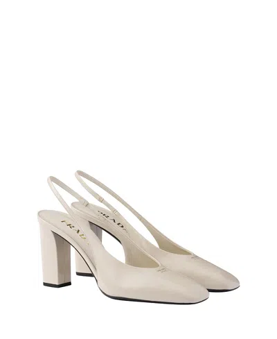 Prada 85 Patent Leather Slingback Pumps In White