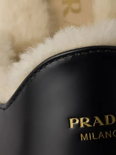 Prada Brushed Leather And Shearling Mules In Black