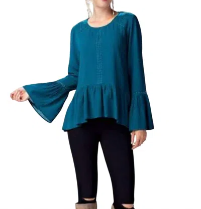 Kori Long Sleeve Round Neck Top With Ruffled Hem In Teal In Blue