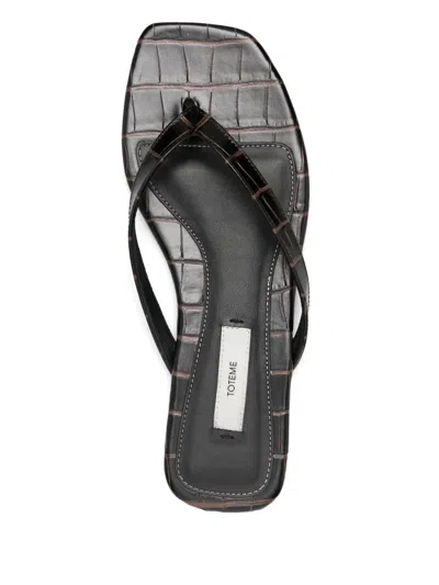 Totême Toteme Leather Thong Sandals In Black
