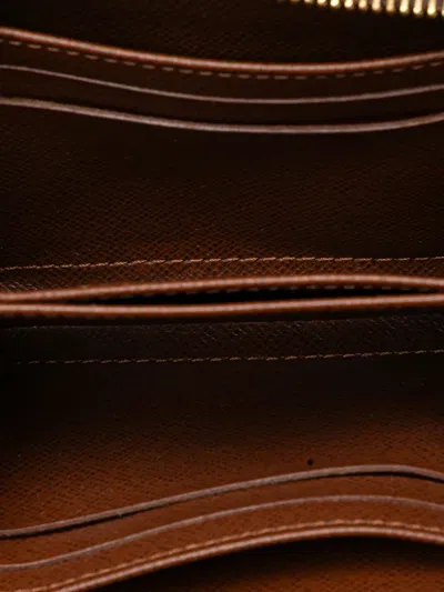 Pre-owned Louis Vuitton 2009 Monogram Zippy Purse Coin Pouch In Brown