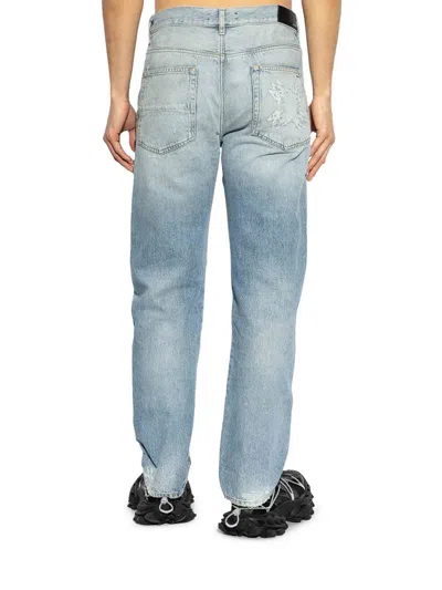 Amiri Clay Indigo Thrasher Lunar New Year Jeans In Azul