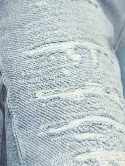 Amiri Clay Indigo Thrasher Lunar New Year Jeans In Azul