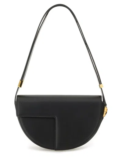 Patou Leather Shoulder Bag With Adjustable Strap In Black