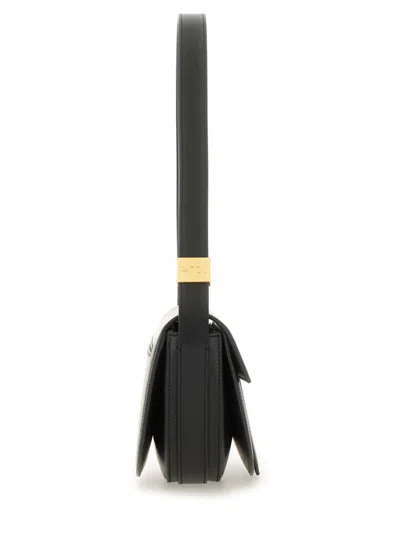 Patou Leather Shoulder Bag With Adjustable Strap In Black