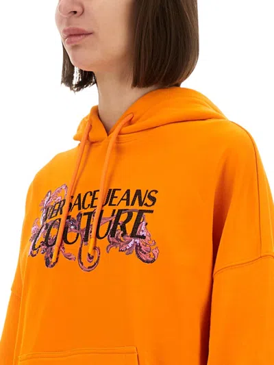 Versace Jeans Couture Hoodie With Logo And Crystals In Orange