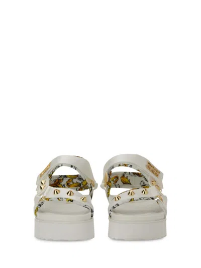 Versace Jeans Couture Sole Sandals With Decorative Logo Strap In Neutrals