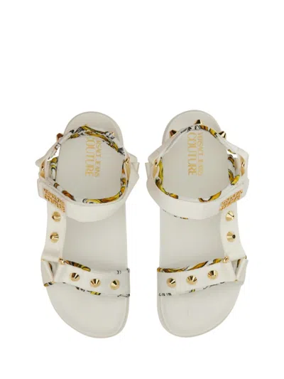 Versace Jeans Couture Sole Sandals With Decorative Logo Strap In Neutrals