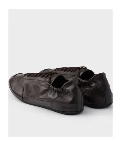 Prada Collapse Leather Sneakers In Black