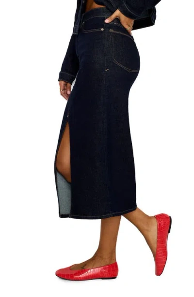 Good American Front Slit Denim Midi Skirt In Indigo716