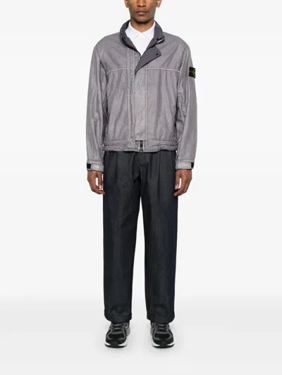 Stone Island Jacket With Transparent Resins And Foldable Co11ar In Blue