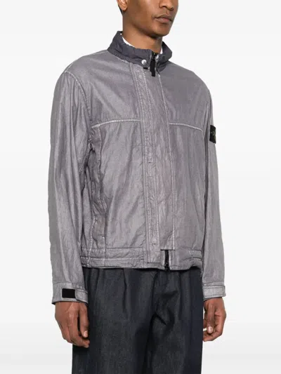 Stone Island Jacket With Transparent Resins And Foldable Co11ar In Blue