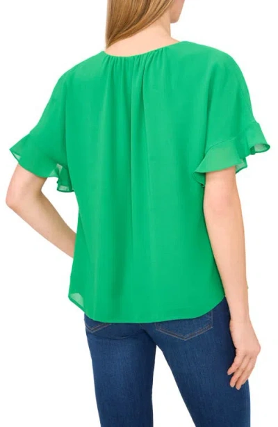 Cece Flutter Sleeve Georgette Top In Medium Green