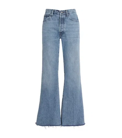 Frame Le Easy Flare Frayed Jeans In Blue