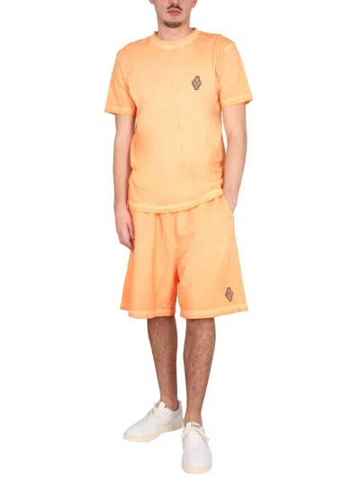 Marcelo Burlon County Of Milan Marcelo Burlon Bermuda With Logo In Orange