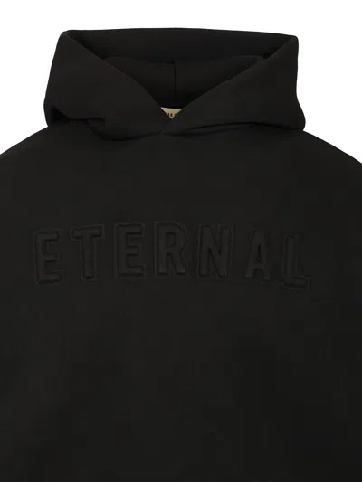 Fear Of God Logo Embossed Hoodie In Black