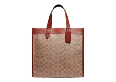 Pre-owned Coach Women's  Tote In Signature Canvas With Horse And Carriage Print Field In Brass/tan Truffle Rust