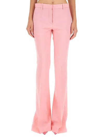 Versace Pink Flare Pants With Tonal Logo Lettering In Wool Woman In Pink