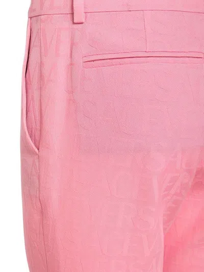 Versace Pink Flare Pants With Tonal Logo Lettering In Wool Woman In Pink
