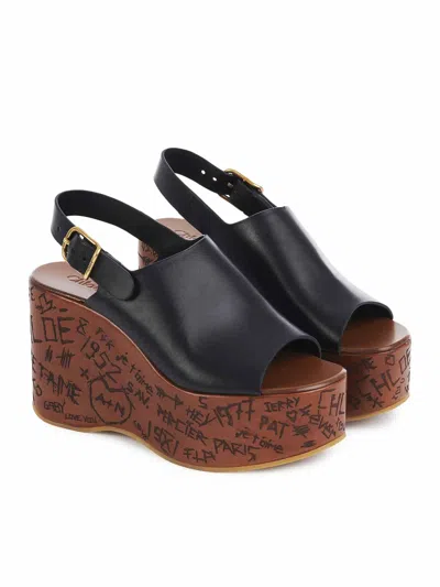 Chloé Maxime Black Wedge With Engraved Written Decorations And Logo Buckle In Leather Woman In Black