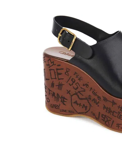 Chloé Maxime Black Wedge With Engraved Written Decorations And Logo Buckle In Leather Woman In Black