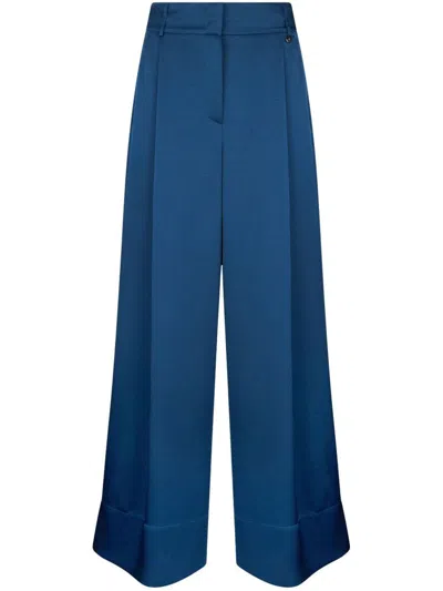 LIU •JO LIU JO WIDE-LEG BLUE FLARED PANTS WITH A PRESSED CREASE 