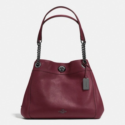 Shop Coach Turnlock Edie Shoulder Bag In Polished Pebble Leather In : Dark Gunmetal/burgundy