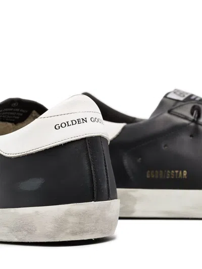 Golden Goose 'super-star' Black Low Top Sneakers With Logo Patch And Suede Details In Leather Man