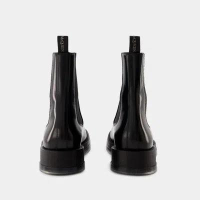 Alexander Mcqueen Black Leather Float Ankle Boots In Black