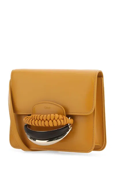 Chloé Versatile Leather Clutch With Unique Front Handle
