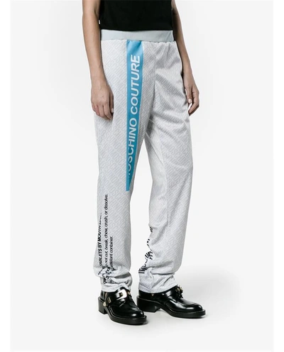 Shop Moschino Pill Packet Print Tracksuit Bottoms