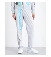MOSCHINO Capsule-print shell track trousers