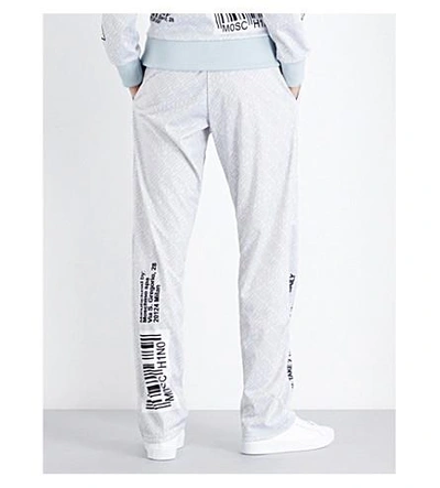 Shop Moschino Capsule-print Shell Track Pants In Grey