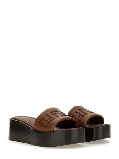 Fendi Women Brown Slides With Wedge Heel And Ff Motiv On The Band In Leather Man