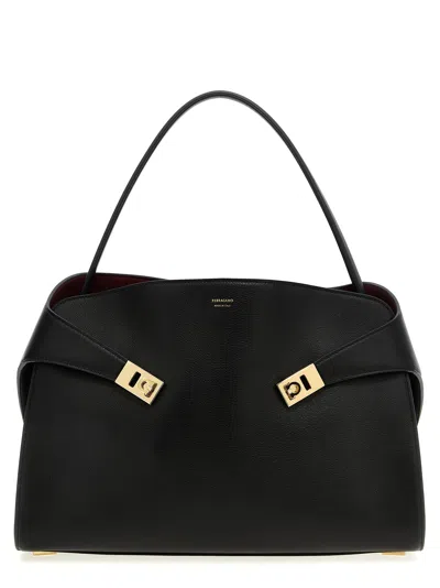Shop Ferragamo Hug Soft M Shoulder Bags Black