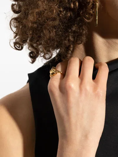 Alexander Mcqueen Polished Gold-tone Ring With Engraved Skull Design In Gold