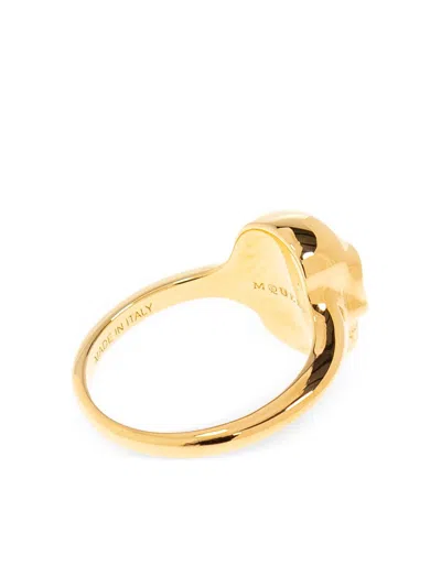 Alexander Mcqueen Polished Gold-tone Ring With Engraved Skull Design In Gold