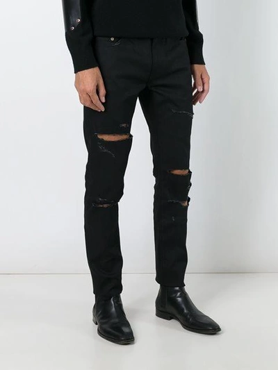 Shop Saint Laurent Distressed Slim Fit Jeans